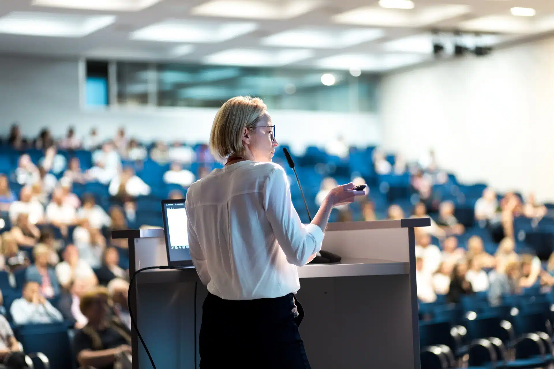 Female,Speaker,Giving,A,Talk,On,Corporate,Business,Conference.,Unrecognizable